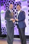 Joseph P. O’Neil, Board Chairman, IPC, presenting the award to Chris Larocca, President, OK International.